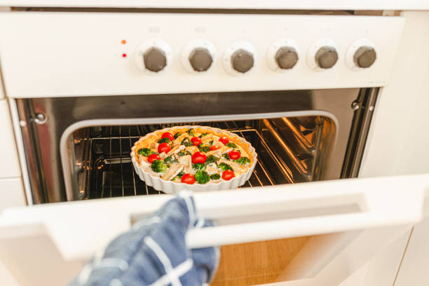 istock Take cooked cake out of oven 1390833261