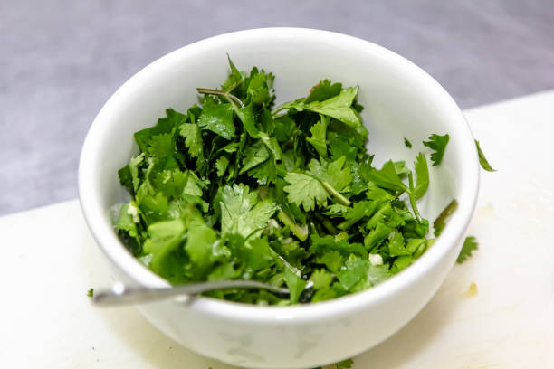 istock Chopped parsley lies in a white bowl on the table 1390834659