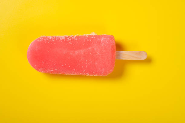 istock top view fresh pink popsicle on a yellow background 1390834711