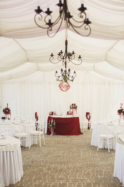 istock Beautiful Banquet hall under a tent for a wedding reception 1390834761