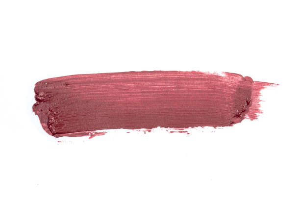 istock Lip stick pink red orande smudge background texture 1390834800