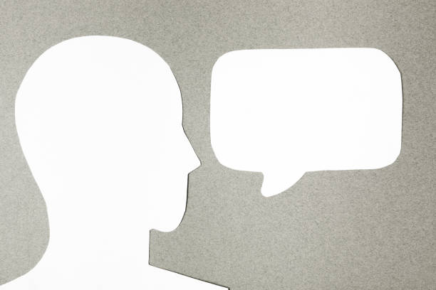 istock paper face and speech bubble on colorbackground copy space for text, communication, symbolic 1390834917