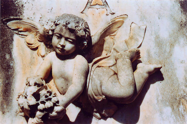 istock Sweet Angel Holding Flowers 139083493