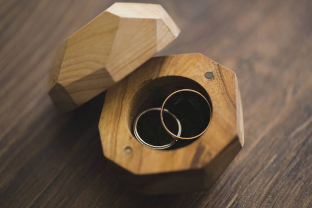 istock Wedding rings in a wooden box on the table. 1390835758