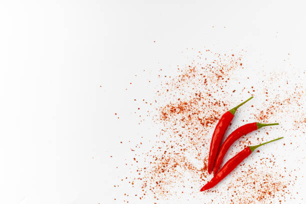 istock Red hot chili peppers isolated on white background. 1390839414