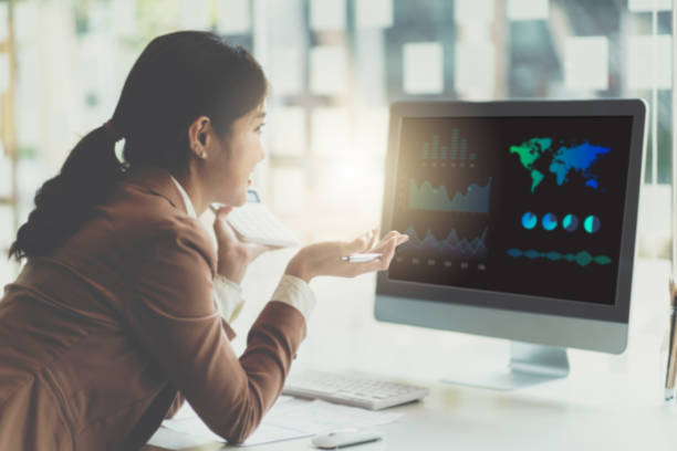 istock Asian Business woman Data Analyst Woman Using Computer. 1390839743