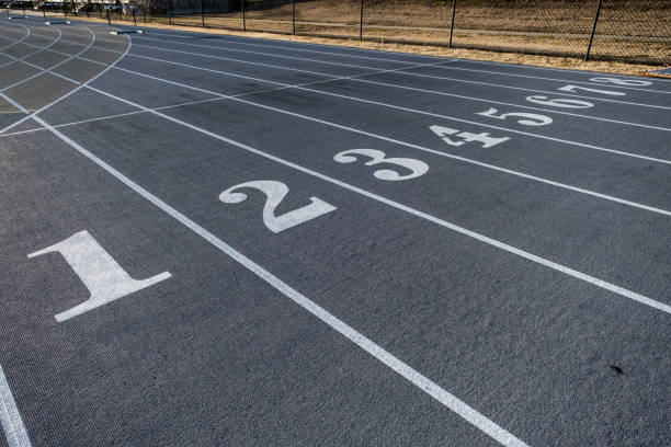istock Numbered Lanes of a Track and Field Starting Point 1390842205