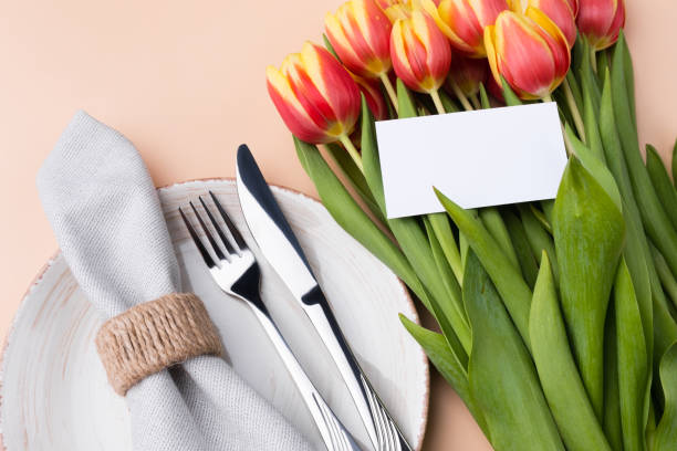 istock Elegantly holiday dinner table. Festive table setting at neutral beige color top view. 1390844141