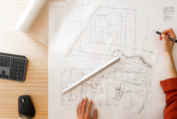 istock Top view of architect drawing on architectural project 1390844260