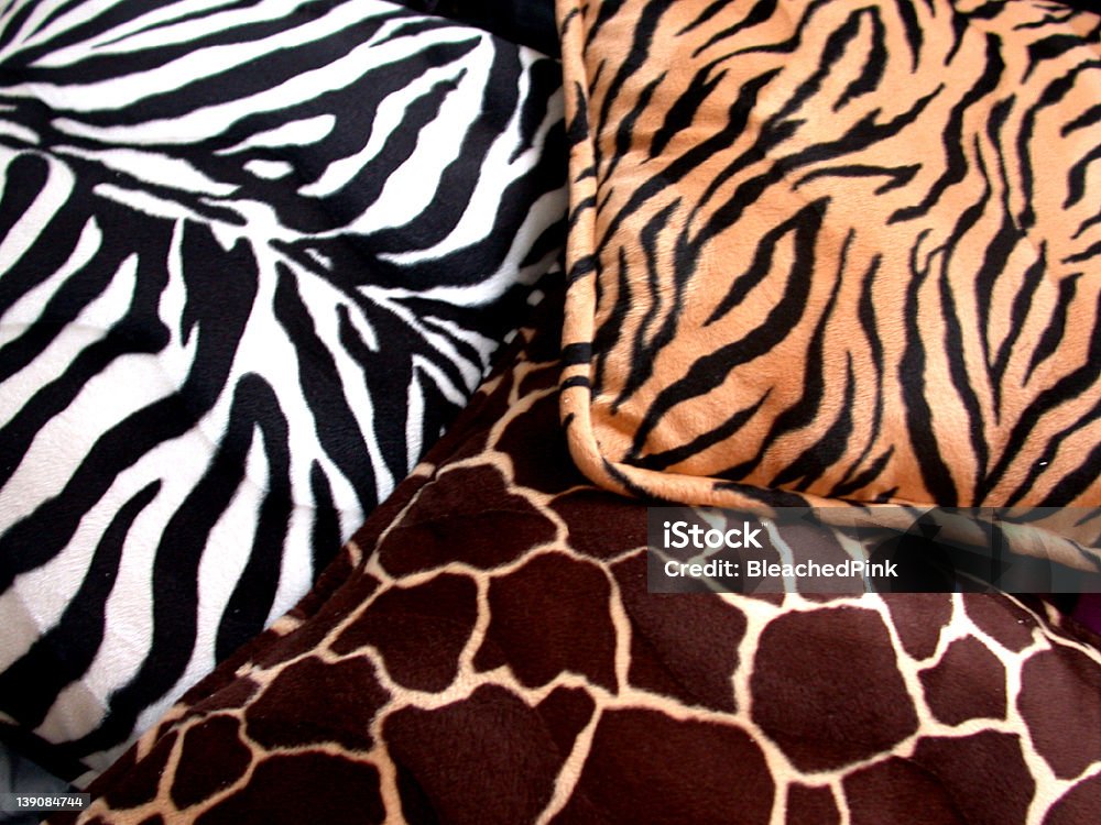 animal print pillows Giraffe, zebra, and tiger print pillows. Pillow Stock Photo
