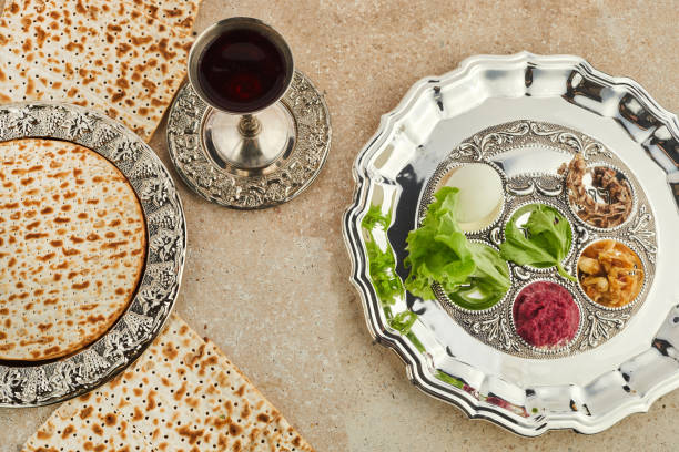 istock Passover Seder plate with traditional food ontravertine stone background 1390848196