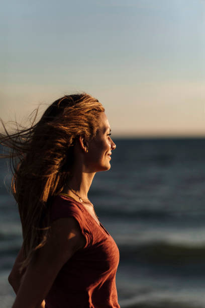 istock Girl looking at sunset 1390848206