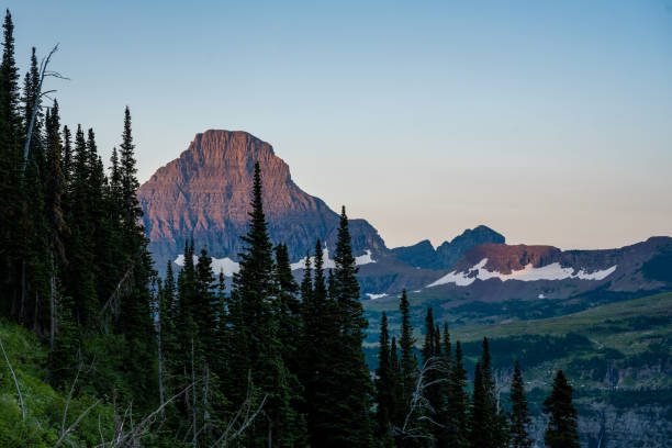istock First Light Begins to Hit The Logan Pass Area From Highline Trail 1390848514