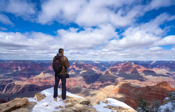istock Man looking at beautiful winter mountain scenery in Arizona. 1390850454