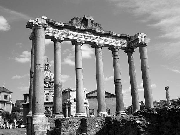 The remains of the ionic columns and pediment of the Temple of Saturn in the Roman Forum