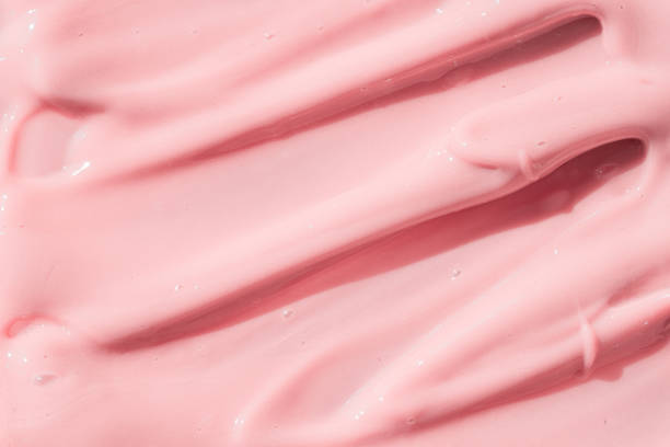 istock Pink color cosmetic cream lotion moisturizer smear smudge sample. Beauty cream texture background. Skin care product strokes closeup. 1390851137