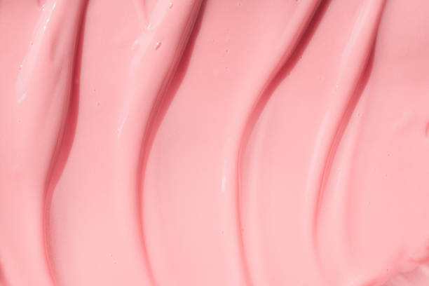 istock Moisturizing beauty creme, balm swatch, pink paint, yogurt texture. Peach cream, moisturizer, shampoo spread, sunscreen cosmetic smear background. Creamy pink skincare lotion product closeup. 1390852705