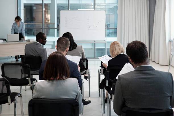 istock Group of contemporary economists analyzing financial documents with data 1390852801