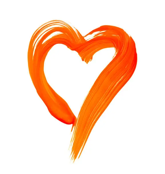 Photo of Heart Shape made of orange yellow paint with brush