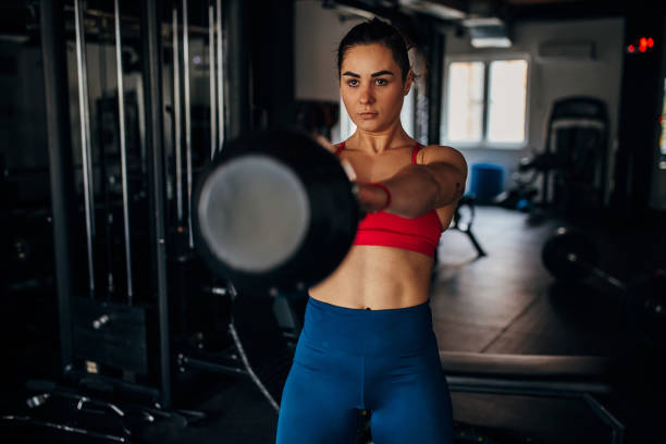 istock Fit woman training with kettlebell 1390855094