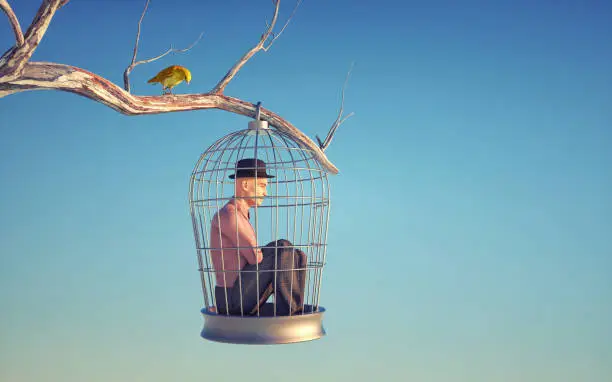 Man inside a bird cage in a tree. Behavior change and future choices concept.. This is a 3d render illustration