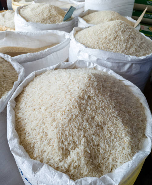 White rice Several sacks of raw white rice at a food market in the Dominican Republic. silo bag stock pictures, royalty-free photos & images
