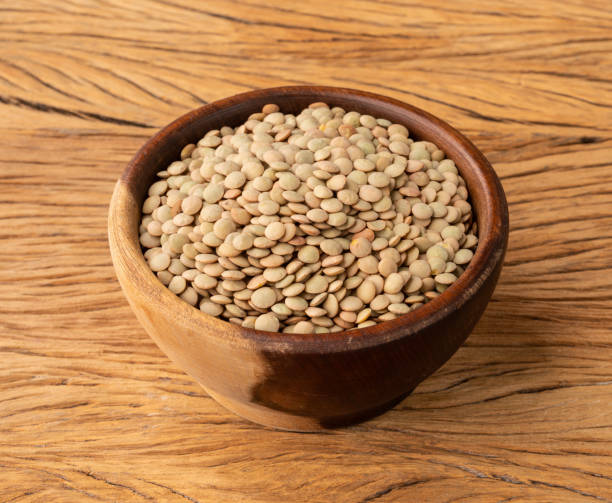 istock Raw lentils in a bowl over wooden table 1390860099