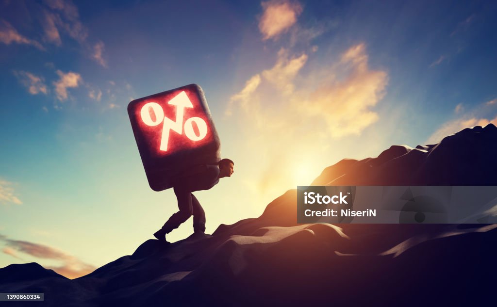 Man carrying heavy stone with growing interest rate symbol Man carrying heavy stone with growing interest rate symbol increasing debt. 3D. Interest Rate Stock Photo