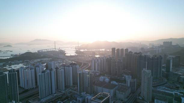 istock crowded city and harbor view during sunset in Hong Kong 1390861043
