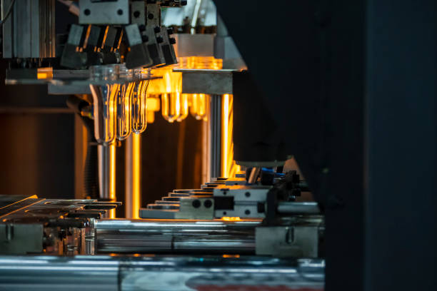 istock The drinking water bottle manufacturing process by blow mold machine. 1390861134