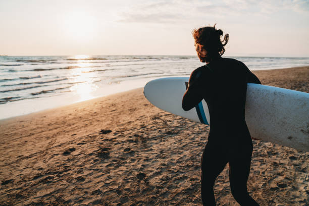 istock A man is running to the sea with his surfboard 1390861738