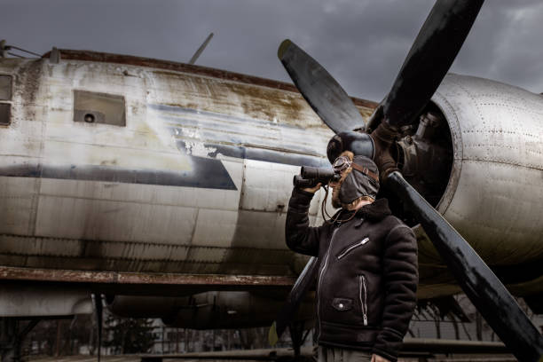 istock A young manposes in an airplane cemeteryas an old-fashioned pilot 1390862426