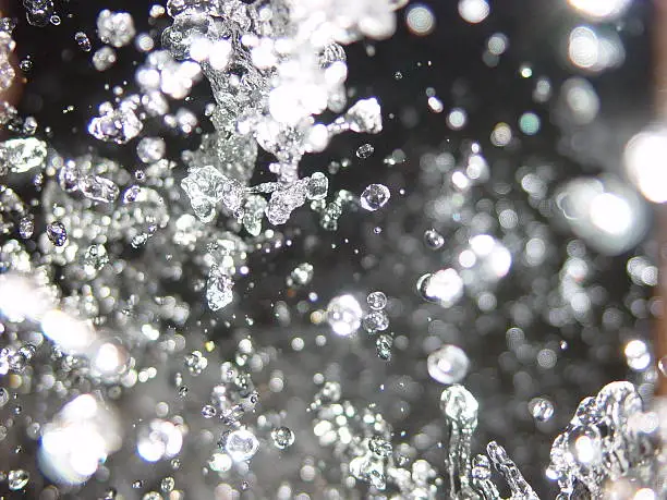 Crystal-like water droplets on black background