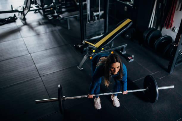 istock Strong woman weightlifting 1390865617