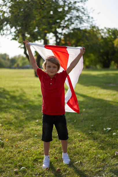 People at a protest in Belarus. Boy with a flag at a protest. stock photo