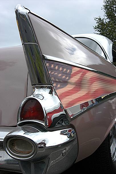 Right Rear Quarter View of a 1957 Chevrolet Belair Rear View of a 1957 Chevy Tailfin and taillight.  This Chevrolet Belair is painted in two tone Dusk Pearl and Ivory White bel air photos stock pictures, royalty-free photos & images
