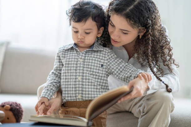 istock Reading at Home With Mommy 1390866649
