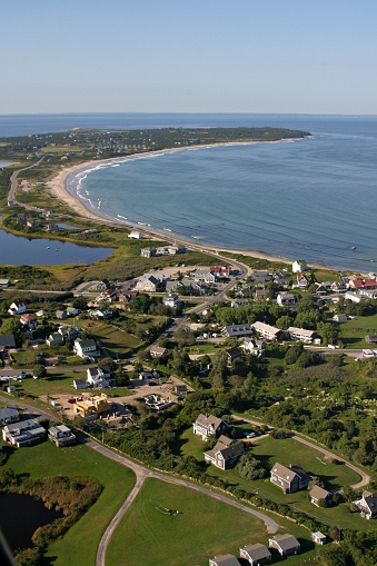 An aerial shot taken over the middle of Block Island, off the shore of Rhode Island, USA.  Visible are a number of homes and businesses of New Shoreham, the only town on this tiny getaway.