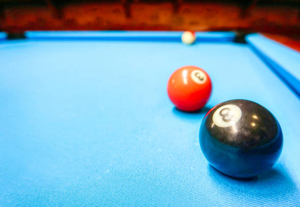 istock Billiards game - black and orange balls 1390867890