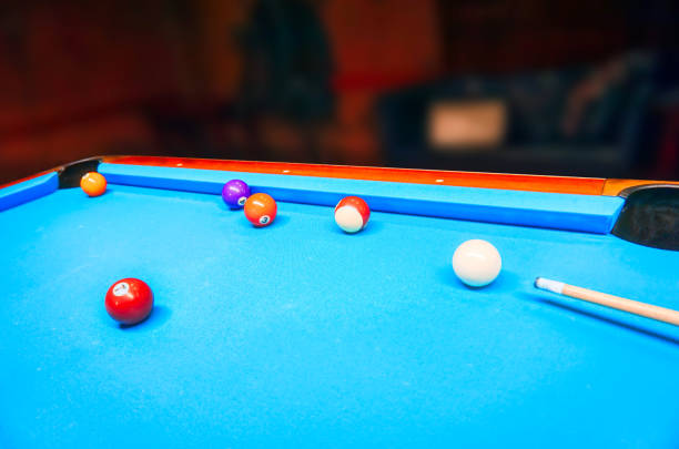 istock Billiards game - white and colorful balls on a table 1390867924