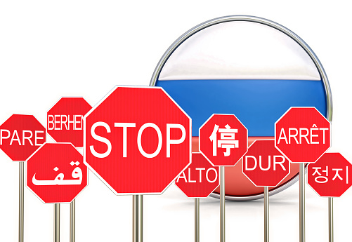 Stop signs with a Russian Flag behind, stop war concept