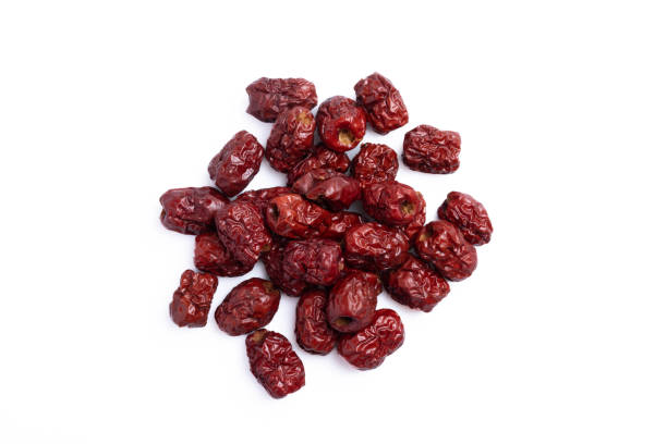 istock Dried Chinese jujube piled on a white background. Isolated image. 1390868406