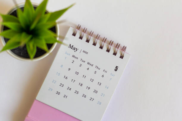 istock Desktop calendar for May 2022 for planning.Spring is in the yard. 1390870009