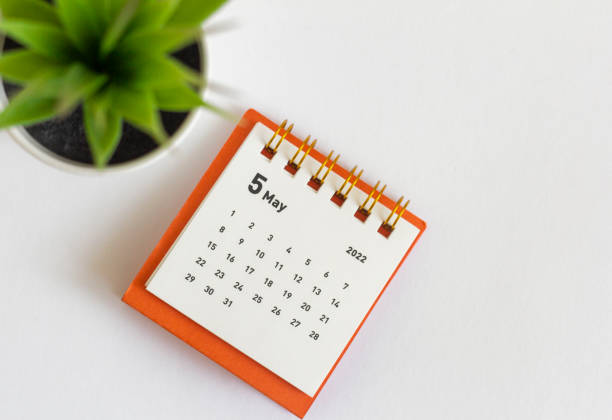 istock Desktop calendar for May 2022 for planning.Spring is in the yard. 1390870020