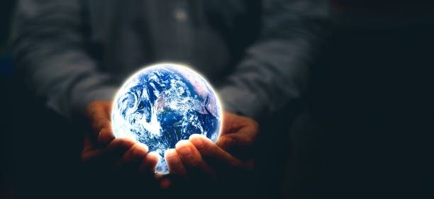 istock hands hold glowing globe for world protection The source of the map from https://www.nasa.gov/ 1390870772