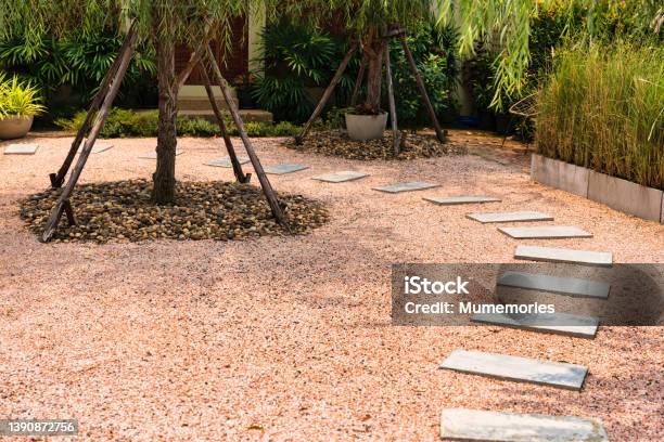 Zen Stone Path On Gravel Floor In The Garden Stock Photo - Download Image Now - Abstract, Agricultural Field, Art