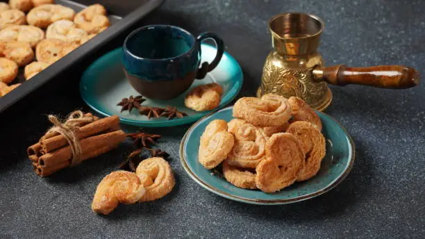 Palmier biscuits - french cookies made of puff pastry also called palm leaves, elephant ears or french hearts