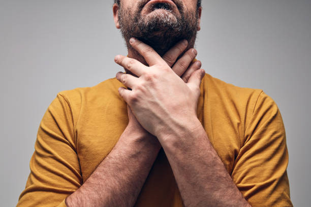 Adult man with throat pain, choking, swallowing and panic, anxiety issues. Adult man with throat pain, choking, swallowing and panic, anxiety issues. choking stock pictures, royalty-free photos & images