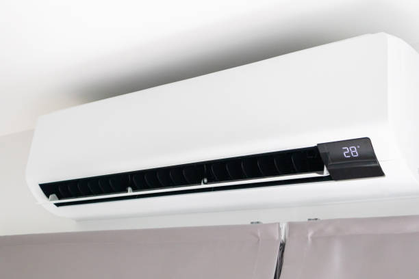 istock Air conditioner on white wall room interior background 1390877858