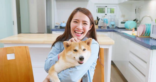 istock girl hugs dog with smile 1390877964